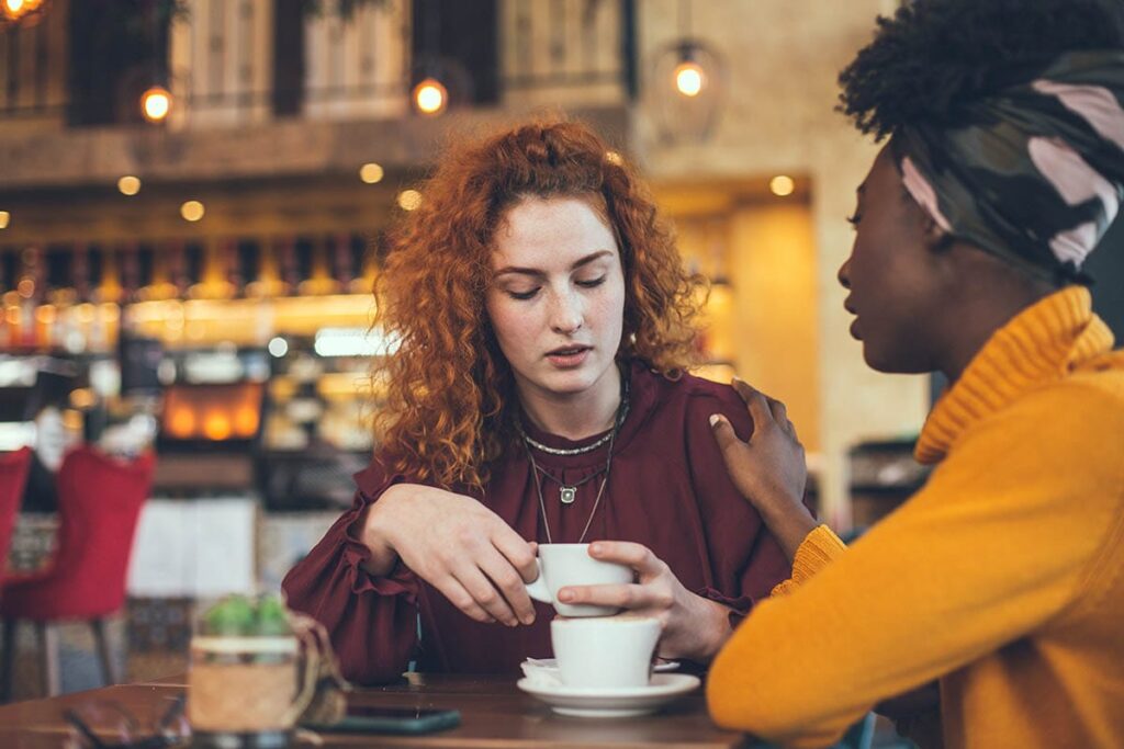 a woman helps a friend avoid relapse by getting coffee