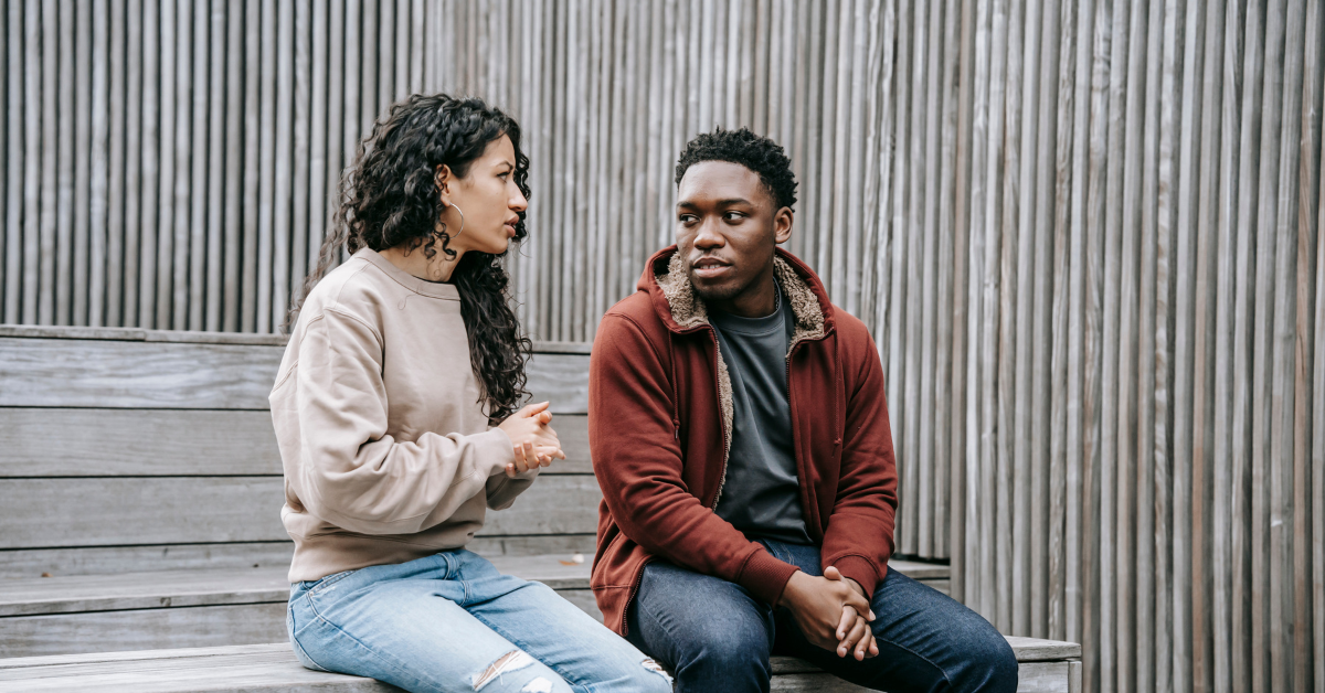 A couple having a firm conversation about setting boundaries because one of them is in recovery