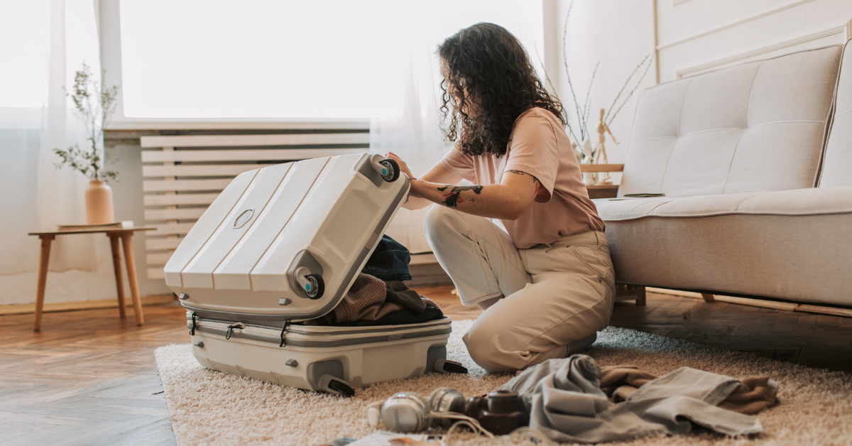 A young woman packing her suitcase after choosing the right drug treatment program