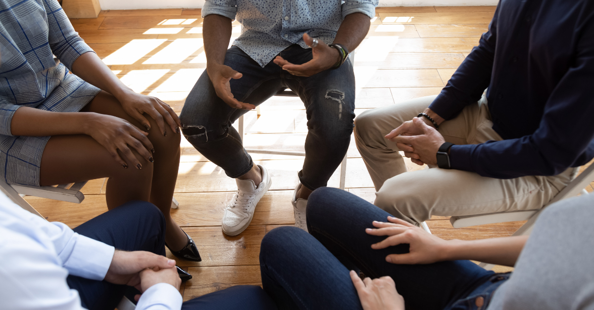 A person managing addiction with their support group.