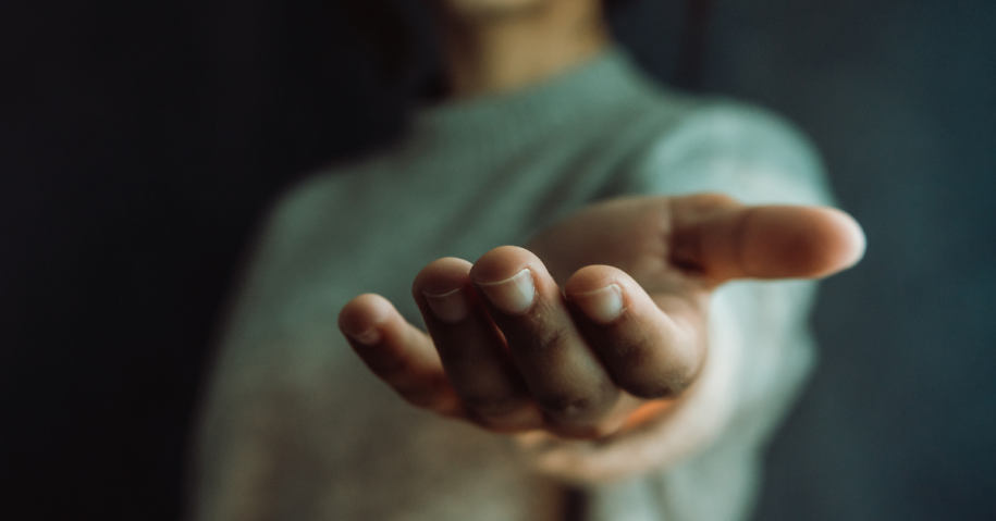 Woman extending hand in a helping manner